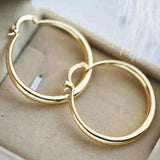 Grosse Boucles d'oreilles créoles dorées