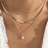 Collier en couche avec pendentif