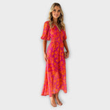Katty – Robe midi avec décolleté en V, motif floral et manches bouffantes