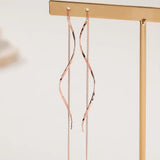 Boucles d'oreilles longues avec design ondulé