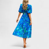 Clara - Robe midi à fleurs élégante